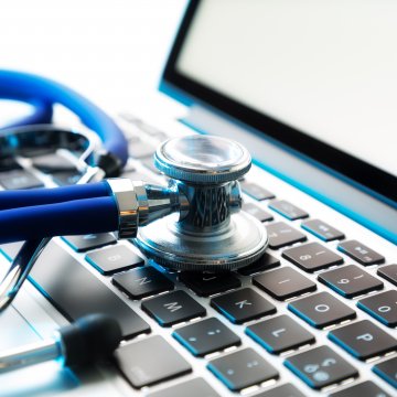 RegClean Pro registry cleaners software stethoscope on laptop keyboard